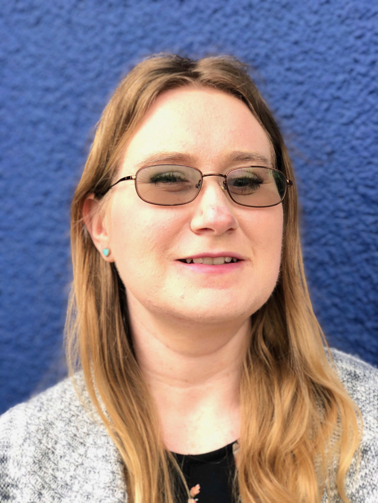 Picture shows Lindsay, with blonde hair and blue eyes, wearing a floral shirt.